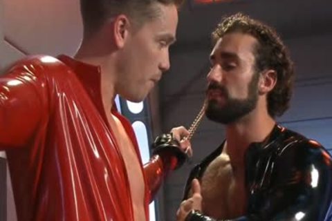 sadomasochism Poor twink In Shiny Catsuit fastened And gangbanged